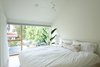 Modern home with Ceiling Lighting. This bedroom has a king bed, blackout shades and a white noise machine for the lightest of sleepers to relax. Photo 14 of 111 House