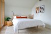 Modern home with Ceiling Lighting. The second bedroom has a queen bed and private deck to enjoy. Photo 17 of 111 House