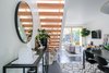 Modern home with Staircase and Wood Tread. The open staircase brightens the space and makes it feel spacious and beautiful. Photo 4 of 111 House