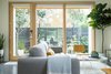 Modern home with Living Room. A view of the back patio from the living room, designed to be an extension of the interior space. Photo 12 of 111 House