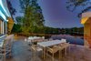 Modern home with Outdoor, Horizontal Fences, Wall, Back Yard, Trees, Landscape Lighting, Concrete Pools, Tubs, Shower, and Concrete Patio, Porch, Deck. View from terrace to Lake Barcroft Photo 2 of Jafari Residence