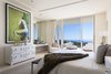 Modern home with Bedroom, Bed, Ceiling Lighting, and Dresser. The residence has undergone two meticulous renovations and combines elements of Modernism, Post-modernism, Neo-classicism and Art Deco. Photo 6 of The Modernist Island in a Spanish Sea: A Groundbreaking Residential Design by James Morris, AIA