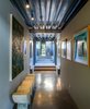 Modern home with Hallway and Cement Tile Floor. The rooms, divided into two parallel wings, are linked together through a glass passageway, separating the estate’s public and private spaces in a totally unique way. Photo 6 of Iconic Modernism by Barton Myers