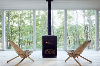 Floor-to-ceiling windows grace the living area.
