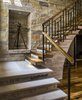 Modern home with Staircase, Wood Tread, Stone Tread, Wood Railing, and Metal Railing. Built by Sheehan Built Homes www.sheehanbuilthomes.com Photo 3 of Modern Custom Farmhouse