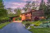 Modern home with Exterior, Wood Siding Material, and House Building Type. The pitched roof is a classic Prairie style known of Frank Lloyd Wright's design. Photo of Frank Lloyd Wright's Small Masterpiece: The Haddock House