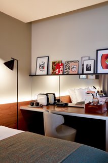 Local books and artwork bring Barcelona's vibrant culture into the guest rooms.