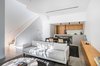 Modern home with Living Room, Console Tables, Sofa, Porcelain Tile Floor, and Recessed Lighting. Living Room Photo 7 of Throckmorton Renovation
