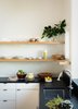 Modern home with Kitchen, Stone Counter, and Undermount Sink. Floating shelving in the kitchen adds to the open and airy interior feel. Photo 3 of Noe Valley Residence
