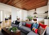 Modern home with Living Room, Sofa, Coffee Tables, Medium Hardwood Floor, Light Hardwood Floor, and Recessed Lighting. The updated floor plan was completely reworked and expanded to create new interior volumes. Photo 4 of Noe Valley Residence