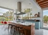 The island displays interlocking joints at the corners, highlighting the full dimension of the solid walnut wood wrap. Photo 2 of Modern-Day California Ranch House modern home