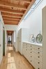 A linear skylight bathes the wall of the dressing room in natural light. Photo 5 of Modern-Day California Ranch House modern home