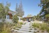 Other active sustainable features included grey water harvesting, whereby the bathing and laundry water are stored and repurposed to flush toilets and irrigate the landscape, as well as photovoltaic panels that produce electricity and solar thermal plans that preheat the domestic and pool water. Photo 7 of Modern-Day California Ranch House modern home