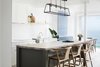 Original BTC's Diner 125 pendant in weathered brass. The light has 4 lamp holders, with glass on 4 sides and an open top and base. Photo of Bronte Beach Marine Residence modern home