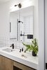 Modern home with Bath Room, Undermount Sink, Engineered Quartz Counter, Wall Lighting, Open Shower, and Subway Tile Wall. Both bathrooms feature subway tile, distressed white oak cabinetry and Edison Bulb light fixtures. Photo 5 of Crosby Loft