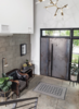 Modern home with Staircase, Wood Tread, Metal Railing, and Metal Tread. Entry Foyer Detail 01 Photo 6 of 400 SOLA