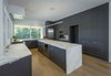 Modern home with Kitchen, Wine Cooler, Ceiling Lighting, Refrigerator, Stone Tile Backsplashe, Tile Counter, Laminate Cabinet, Drop In Sink, Pendant Lighting, Range Hood, Wood Cabinet, Light Hardwood Floor, Marble Counter, Microwave, Marble Backsplashe, Dishwasher, and Range. Kitchen Photo 9 of Indian Hill Residence