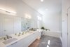 Modern home with Ceiling Lighting, Recessed Lighting, and Drop In Sink. Master Ensuite Bathroom Photo 15 of Indian Hill Residence
