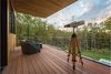 Modern home with Exterior, Metal Roof Material, Flat RoofLine, House Building Type, Stucco Siding Material, Wood Siding Material, and Metal Siding Material. Balcony Photo 20 of Indian Hill Residence