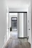 Modern home with Hallway and Medium Hardwood Floor. Mudroom hallway Photo 2 of Pleasant St. Urban Abode