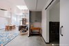 Inspired by the way light moves through abandoned buildings with their open simplicity, Waldron enhanced dark corners as well, embracing their unique shadows and mystery. Photo 7 of Vashon Hangar Conversion modern home