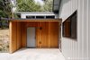 As a pet-sitter, this homeowner uses this space out back to dry off the dogs before they run inside! Photo 9 of Vashon Hangar Conversion modern home