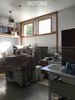 The original double doors that inspired a light and tall entry space. Photo 12 of Vashon Hangar Conversion modern home