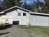 Modern home with Garage and Garage Conversion Room Type. The original hangar- used at the time of this photo as a storage space. Photo 10 of Vashon Hangar Conversion