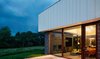 Modern home with Exterior, House Building Type, Flat RoofLine, Concrete Siding Material, Glass Siding Material, and Metal Siding Material. Rear Exterior Photo 2 of Catskills House