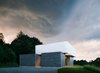 Modern home with Exterior, Concrete Siding Material, Metal Siding Material, Flat RoofLine, and House Building Type. Front Exterior Photo 3 of Catskills House