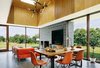 Modern home with Dining Room, Wood Burning Fireplace, Pendant Lighting, Chair, Table, and Concrete Floor. Living Dining Room Photo 5 of Catskills House