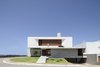 Modern home with Exterior, Beach House Building Type, House Building Type, Concrete Siding Material, Green Roof Material, Wood Siding Material, Flat RoofLine, Green Siding Material, and Metal Siding Material. IF House - Photo 07 Photo 7 of IF House