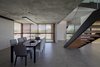 Modern home with Dining Room, Porcelain Tile Floor, Table, Concrete Floor, Ceiling Lighting, Pendant Lighting, Chair, and Lamps. IF House - Photo 04 Photo 4 of IF House