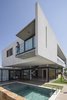 Modern home with Exterior, Glass Siding Material, Beach House Building Type, Concrete Siding Material, Wood Siding Material, Metal Siding Material, House Building Type, Flat RoofLine, Green Roof Material, and Green Siding Material. IF House - Photo 10 Photo 10 of IF House