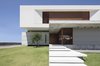 Modern home with Exterior, Green Siding Material, House Building Type, Beach House Building Type, Wood Siding Material, Metal Siding Material, Flat RoofLine, Green Roof Material, and Concrete Siding Material. IF House - Photo 09 Photo 9 of IF House