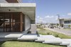 Modern home with Exterior, Flat RoofLine, House Building Type, Green Roof Material, Beach House Building Type, Wood Siding Material, Concrete Siding Material, and Green Siding Material. IF House - Photo 11 Photo 11 of IF House