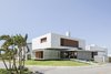 Modern home with Exterior, Green Roof Material, Metal Siding Material, House Building Type, Flat RoofLine, Concrete Siding Material, Wood Siding Material, Beach House Building Type, and Green Siding Material. IF House - Photo 05 Photo 5 of IF House
