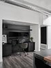 Modern home with Office, Chair, Vinyl Floor, Desk, and Study Room Type. The custom desk by Lignum Cabinets transforms into standing desk with the touch of a button Photo 6 of Waterfall House