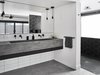 Modern home with Bath Room, Wall Mount Sink, Subway Tile Wall, Pendant Lighting, and Concrete Counter. Floating Concrete sink by Compound Concrete with a floating Fenix drawer by Lignum Cabinets Photo 14 of Waterfall House
