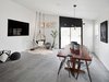 Modern home with Dining Room, Table, Porcelain Tile Floor, and Pendant Lighting. The second living and dining space. Televisions were mounted flush into the wall. The doors were given custom full-height trim. Photo 8 of Details