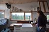 Modern home with Kitchen, Engineered Quartz Counter, Wood Counter, Undermount Sink, Subway Tile Backsplashe, Range Hood, White Cabinet, and Range. The kitchen is designed to be both compact and functional. Photo 2 of The San Juan Tiny House