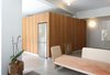 Modern home with Living Room, Bench, Concrete Floor, Sofa, Ceiling Lighting, and Wall Lighting. Living Room, Sofa designed by the Architects Photo of Nahmani Tel Aviv Apartment
