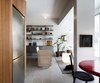 Modern home with Living Room, Concrete Floor, Sofa, Bench, Ceiling Lighting, Accent Lighting, and Bookcase. Living Room and Kitchen Photo 2 of Nahmani Tel Aviv Apartment