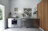 Modern home with Kitchen, Pendant Lighting, Drop In Sink, Engineered Quartz Counter, Concrete Floor, Wall Oven, Cooktops, Metal Cabinet, and Dishwasher. Stainless steel Ikea kitchen elevated by the cherry wood cabinetry Photo 6 of Nahmani Tel Aviv Apartment