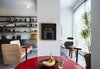 Modern home with Dining Room, Stools, Table, Concrete Floor, Ceiling Lighting, and Chair. Kitchen table, Danish design from the 70s. Photo 7 of Nahmani Tel Aviv Apartment