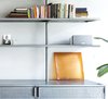 Modern home with Living Room, Ceiling Lighting, Concrete Floor, and Bookcase. Detail of the custom book shelves Photo 9 of Nahmani Tel Aviv Apartment