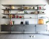 Modern home with Living Room, Bookcase, Ceiling Lighting, and Concrete Floor. Custom book shelves out of perforated steel Photo 10 of Nahmani Tel Aviv Apartment