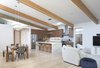 Modern home with Dining Room, Bench, Stools, Table, Accent Lighting, Storage, Chair, Light Hardwood Floor, and Recessed Lighting. Open plan gives the space a loft-like feel. Photo 3 of Hedge