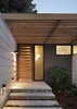 Modern home with Exterior, House Building Type, Green Siding Material, and Flat RoofLine. Entry way has a modern feel with custom door and lighting. Photo 7 of Hedge