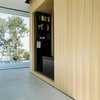 Modern home with Living Room, Gas Burning Fireplace, Dark Hardwood Floor, Bench, and Ceiling Lighting. little library Photo 8 of Villa Hohenlohe